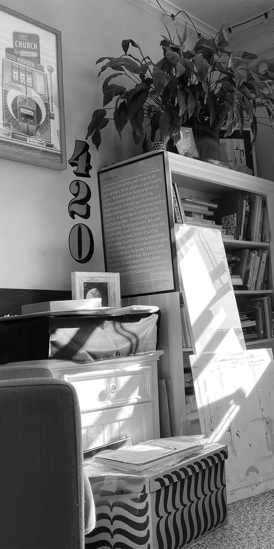 View of somewhat cluttered studio at Hampton Visual, sunny and joyful.