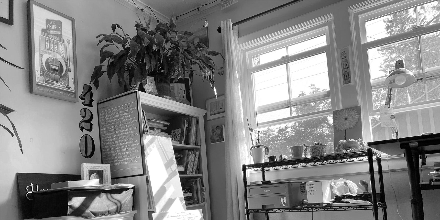 View of somewhat cluttered studio at Hampton Visual, sunny and joyful.